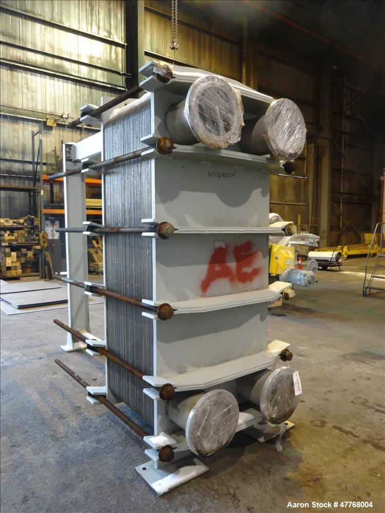 Used Tranter Superchanger Plate Heat Exchanger, Approximate 3421.8 Square Feet Surface Area, Model UX-896-UP-189. Approximate (139) 40" wide x 92" tall 316 stainless steel plates rated 125 psi at 38 ...