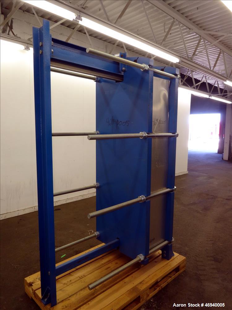 Unused- WCR Incorporated Plate Heat Exchanger, Model WCR-A891M, 741.1 Square Feet, 316 Stainless Steel, Vertical. (42) Approximate 15" wide x 67" long plates rated hot/cold sides 150 psi at -50 to 26...