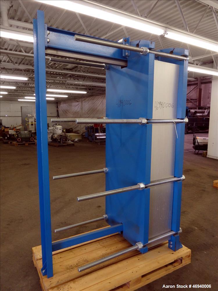 Unused- WCR Incorporated Plate Heat Exchanger, Model WCR-A891M, 741.1 Square Feet, 316 Stainless Steel, Vertical. (83) Approximate 15" wide x 67" long plates rated hot/cold sides 150 psi at -50 to 26...