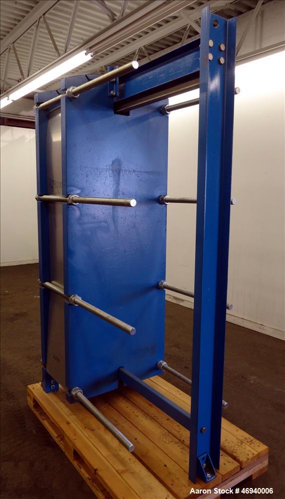 Unused- WCR Incorporated Plate Heat Exchanger, Model WCR-A891M, 741.1 Square Feet, 316 Stainless Steel, Vertical. (83) Approximate 15" wide x 67" long plates rated hot/cold sides 150 psi at -50 to 26...