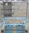 USED: Plate heat exchanger, approximately 40 square feet, 316 stainless steel. 2 sections, (92) approximately 2-3/4