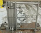 USED: APV plate heat exchanger, model Junior, 316 stainless steel. Approximate 25 square feet. 93 approximate 2-3/4