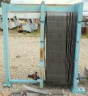 Used APV Plate Heat Exchanger, Approximately 878 Square Feet, Model R57, 316 Stainless Steel. (61) 16