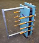 Used Alfa Laval Plate Exchanger, Approximate 84 Square Feet, Model M10-BWFD. (34) Approximately 14-3/4” wide x 34” tall Titanium plates. Rated 10 bar (145 psi) at 10 degrees C. (50 F.). (4) 3-3/4” In...