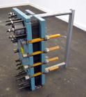 Used Alfa Laval Plate Exchanger, Approximate 84 Square Feet, Model M10-BWFD. (34) Approximately 14-3/4” wide x 34” tall Titanium plates. Rated 10 bar (145 psi) at 10 degrees C. (50 F.). (4) 3-3/4” In...