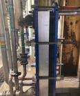 Used Alfa Laval Model M15-BFG TITANIUM 366.92 Sq. Ft. Plate Heat Exchanger. 366.92 Sq. Ft. according to the name plate. Marked as (55) Plates. Extra Plates available as spares.