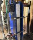 Used Alfa Laval Model M15-BFG TITANIUM 366.92 Sq. Ft. Plate Heat Exchanger. 366.92 Sq. Ft. according to the name plate. Marked as (55) Plates. Extra Plates available as spares.