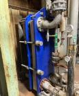 Used Alfa Laval Model M15-BFG TITANIUM 366.92 Sq. Ft. Plate Heat Exchanger. 366.92 Sq. Ft. according to the name plate. Marked as (55) Plates. Extra Plates available as spares.