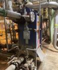 Used Alfa Laval Model M15-BFG Plate And Frame Heat Exchanger. 1207.2 square foot capacity. E-4708B. (181) 0.50mm stainless steel plates.