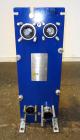 Unused- Alfa Laval Plate Exchanger, 61.35 Square Feet (5.7 Square Meters), Model M6-FG. (40) 316 Stainless steel plates. Designed 10 bar (145 psi) at 60 degrees C (140 F). (2) Inlets, (2) outlets. Mo...