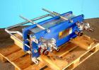 Used Alpha Laval model M6MDFG 58.75 square foot stainless steel plate heat exchanger. A-dim 153mm with (40) .75 mm plates, 2 1/2 in inlet/outlet,  150 PSI @ 230 deg F, (4) eye system.