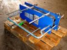 Used Alpha Laval model M6MDFG 58.75 square foot stainless steel plate heat exchanger. A-dim 153mm with (40) .75 mm plates, 2 1/2 in inlet/outlet,  150 PSI @ 230 deg F, (4) eye system.