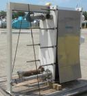 Used Mueller Plate Heat Exchanger, Approximately 831 Square Feet, Model AT40 B-20. (74) 316 Stainless steel plates. Designed for 100 psi max at 150 degrees F max. 4-1/2