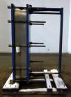Used Mueller Accu-Therm Plate Heat Exchanger, Approximate 700 Square Feet Surface Area, Model AT80-LB-20. Approximate (82) 316 stainless steel plates rated 80psi at -20 to 300 degrees F. (4) 6-3/4