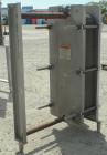 Used Mueller Plate Heat Exchanger, 117.5 Square Feet, Model AT20-SSF-10. (44) 316 Stainless steel plates. Designed for 104 psi at 250 degrees F. 2