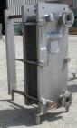 Used Mueller Plate Heat Exchanger, 117.5 Square Feet, Model AT20-SSF-10. (44) 316 Stainless steel plates. Designed for 104 psi at 250 degrees F. 2