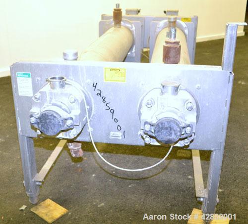 Used APV Scraped Surface Heat Exchanger System, Consisting of: (2) APV scraped surface heat exchangers, model T884SSNN. 14.5 Square feet heating surface per tube, 29 total. 8'' Diameter x 84'' long j...