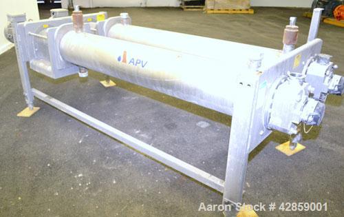 Used APV Scraped Surface Heat Exchanger System, Consisting of: (2) APV scraped surface heat exchangers, model T884SSNN. 14.5 Square feet heating surface per tube, 29 total. 8'' Diameter x 84'' long j...