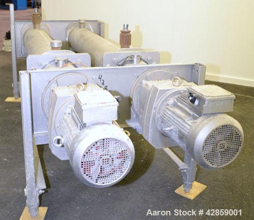 Used APV Scraped Surface Heat Exchanger System, Consisting of: (2) APV scraped surface heat exchangers, model T884SSNN. 14.5 Square feet heating surface per tube, 29 total. 8'' Diameter x 84'' long j...
