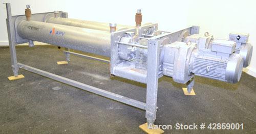 Used APV Scraped Surface Heat Exchanger System, Consisting of: (2) APV scraped surface heat exchangers, model T884SSNN. 14.5 Square feet heating surface per tube, 29 total. 8'' Diameter x 84'' long j...