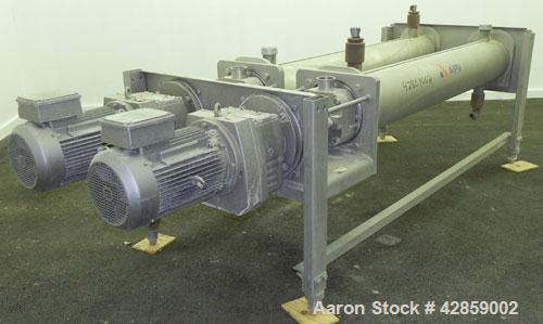 Used APV Scraped Surface Heat Exchanger System, Consisting of: (2) APV scraped surface heat exchangers, model T884SSNN. 14.5 Square feet heating surface per tube, 29 total. 8'' Diameter x 84'' long j...