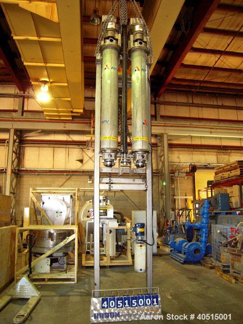 Used APV Vertical Scraped Surface Heat Exchanger System, 316 stainless steel. Consisting of: (2) APV scraped surface heat exchangers, model V884WWNN, 14.5 square feet heating surface per tube, 29 tot...
