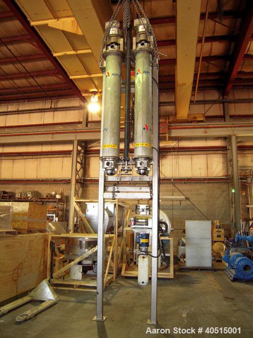 Used APV Vertical Scraped Surface Heat Exchanger System, 316 stainless steel. Consisting of: (2) APV scraped surface heat exchangers, model V884WWNN, 14.5 square feet heating surface per tube, 29 tot...