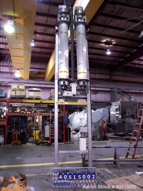 Used APV Vertical Scraped Surface Heat Exchanger System, 316 stainless steel. Consisting of: (2) APV scraped surface heat exchangers, model V884WWNN, 14.5 square feet heating surface per tube, 29 tot...