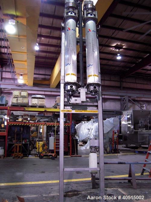 Used APV Vertical Scraped Surface Heat Exchanger System, 316 stainless steel. Consisting of: (2) APV scraped surface heat exchangers, model V884WWNN, 14.5 square feet heating surface per tube, 29 tot...