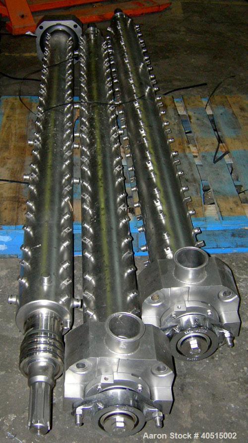 Used APV Vertical Scraped Surface Heat Exchanger System, 316 stainless steel. Consisting of: (2) APV scraped surface heat exchangers, model V884WWNN, 14.5 square feet heating surface per tube, 29 tot...