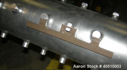 Used APV Vertical Scraped Surface Heat Exchanger System, 316 stainless steel. Consisting of: (2) APV scraped surface heat exchangers, model V884WWNN, 14.5 square feet heating surface per tube, 29 tot...