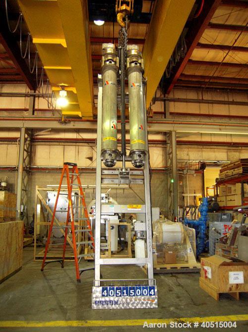 Used APV Vertical Scraped Surface Heat Exchanger System, 316 stainless steel. Consisting of: (2) APV scraped surface heat exchangers, model V884WWNN, 14.5 square feet heating surface per tube, 29 tot...