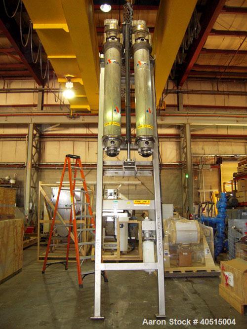 Used APV Vertical Scraped Surface Heat Exchanger System, 316 stainless steel. Consisting of: (2) APV scraped surface heat exchangers, model V884WWNN, 14.5 square feet heating surface per tube, 29 tot...