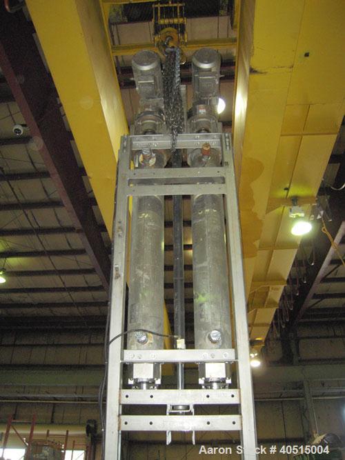 Used APV Vertical Scraped Surface Heat Exchanger System, 316 stainless steel. Consisting of: (2) APV scraped surface heat exchangers, model V884WWNN, 14.5 square feet heating surface per tube, 29 tot...