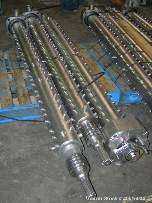 Used APV Vertical Scraped Surface Heat Exchanger System, 316 stainless steel. Consisting of: (2) APV scraped surface heat exchangers, model V884WWNN, 14.5 square feet heating surface per tube, 29 tot...