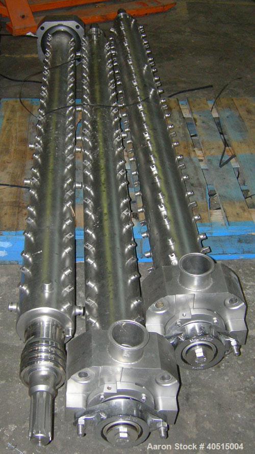 Used APV Vertical Scraped Surface Heat Exchanger System, 316 stainless steel. Consisting of: (2) APV scraped surface heat exchangers, model V884WWNN, 14.5 square feet heating surface per tube, 29 tot...