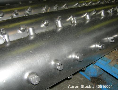 Used APV Vertical Scraped Surface Heat Exchanger System, 316 stainless steel. Consisting of: (2) APV scraped surface heat exchangers, model V884WWNN, 14.5 square feet heating surface per tube, 29 tot...