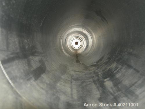 Used Alfa Laval Scraped Surface Heat Exchanger, Approximately 9 Square Feet, Model 6 X 9, 316 Stainless Steel. 6'' diameter x 72'' long horizontal chamber, internal rated 300 psi at 300 deg F, jacket...