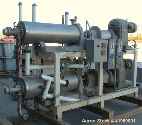 Used Chemetron Votator Scraped Surface Heat Exchanger, 12 total square feet, 304 stainless steel. (2) Approximately 6'' diameter x 48'' long horizontal chambers, plastic type scrapers, carbon steel j...