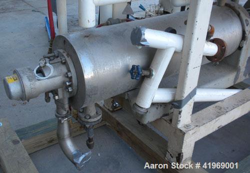 Used Chemetron Votator Scraped Surface Heat Exchanger, 12 total square feet, 304 stainless steel. (2) Approximately 6'' diameter x 48'' long horizontal chambers, plastic type scrapers, carbon steel j...