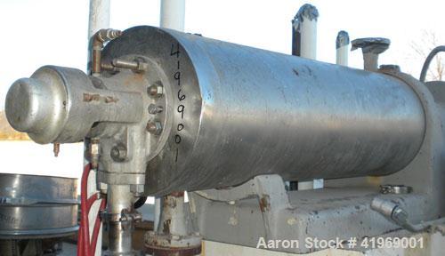 Used Chemetron Votator Scraped Surface Heat Exchanger, 12 total square feet, 304 stainless steel. (2) Approximately 6'' diameter x 48'' long horizontal chambers, plastic type scrapers, carbon steel j...