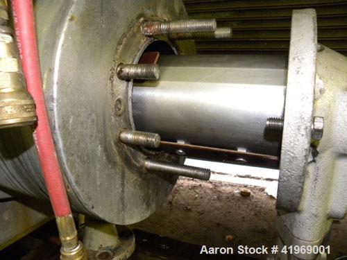 Used Chemetron Votator Scraped Surface Heat Exchanger, 12 total square feet, 304 stainless steel. (2) Approximately 6'' diameter x 48'' long horizontal chambers, plastic type scrapers, carbon steel j...