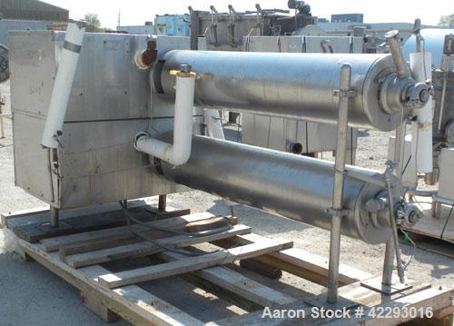 Used Cherry Burrell Thermutator Scraped Surface Heat Exchanger, Model 672L, 316 stainless steel. Approximately 18 square feet ( 9 square feet per tube). (2) 6" Diameter x 72" long jacketed horizontal...