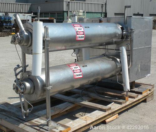 Used Cherry Burrell Thermutator Scraped Surface Heat Exchanger, Model 672L, 316 stainless steel. Approximately 18 square feet ( 9 square feet per tube). (2) 6" Diameter x 72" long jacketed horizontal...
