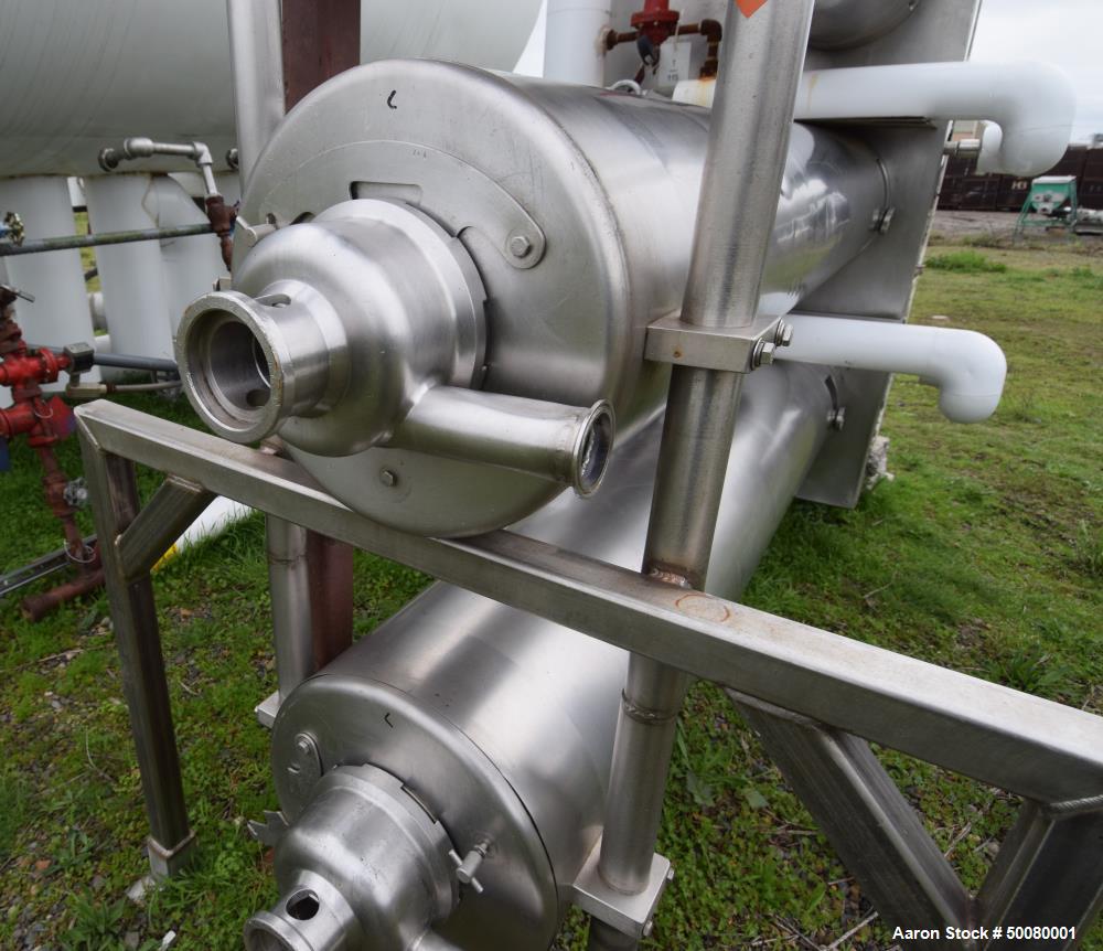 Used Cherry-Burrell Triple Tube Thermutator, 27 Total Square Feet, Stainless Steel. Consists of: (3) model 672 Thermutators, approximate 6" diameter x 72" long jacketed tubes, each 9 square feet heat...