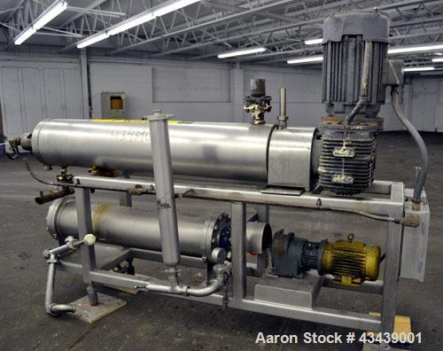 Used Cherry Burrell Votator Scraped Surface Heat Exchanger, 9 Square Feet, 304 Stainless Steel. (1) 6” Diameter x 72” long jacketed horizontal chamber with plastic wipers, and cored shaft. Internal r...