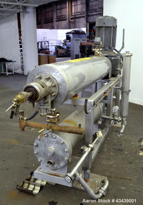 Used Cherry Burrell Votator Scraped Surface Heat Exchanger, 9 Square Feet, 304 Stainless Steel. (1) 6” Diameter x 72” long jacketed horizontal chamber with plastic wipers, and cored shaft. Internal r...