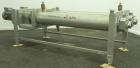 Used APV Scraped Surface Heat Exchanger System, Consisting of: (2) APV scraped surface heat exchangers, model T884SSNN. 14.5 Square feet heating surface per tube, 29 total. 8'' Diameter x 84'' long j...