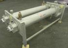 Used APV Scraped Surface Heat Exchanger System, Consisting of: (2) APV scraped surface heat exchangers, model T884SSNN. 14.5 Square feet heating surface per tube, 29 total. 8'' Diameter x 84'' long j...