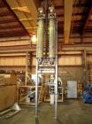 Used APV Vertical Scraped Surface Heat Exchanger System, 316 stainless steel. Consisting of: (2) APV scraped surface heat exchangers, model V884WWNN, 14.5 square feet heating surface per tube, 29 tot...